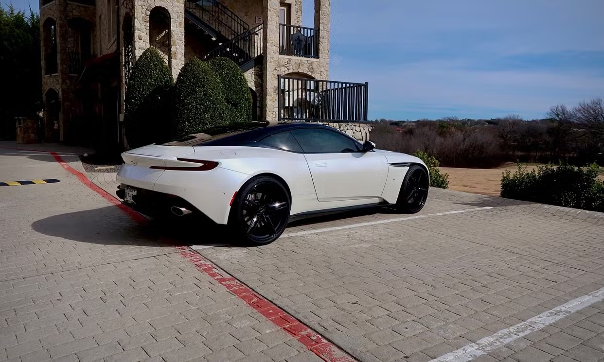 White Aston Martin DB11 rear three-quarter view